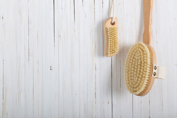 Wooden comb massagersg brushes on wooden planks