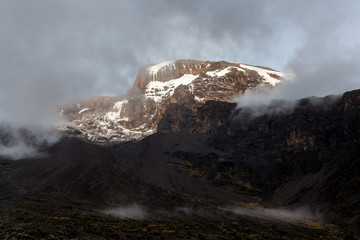 Mount Kilimanjaro and clouds line at sunset, Tanzania