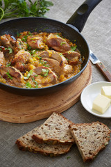 pork pieces in a frying pan