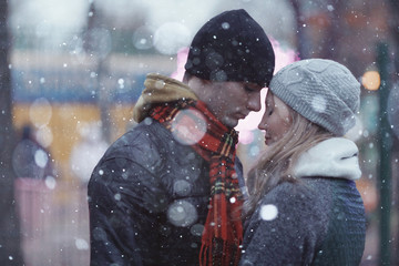 Winter couple walking man and woman, young
