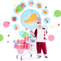 Composite image of santa delivering gifts from cart