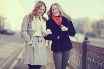 Two girlfriend, Autumn portrait of a walk in the city