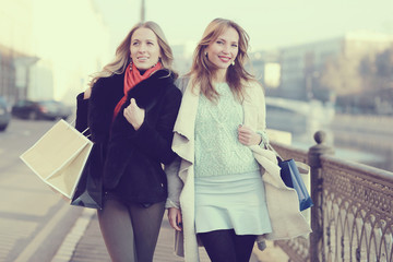 two women friends traveling city happiness