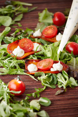 halved tomatoes and homemade mayo on grilled pieces of sweet pep
