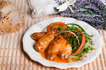 chicken in sweet sour sauce with salad of carrots leek on a plate still life Provence