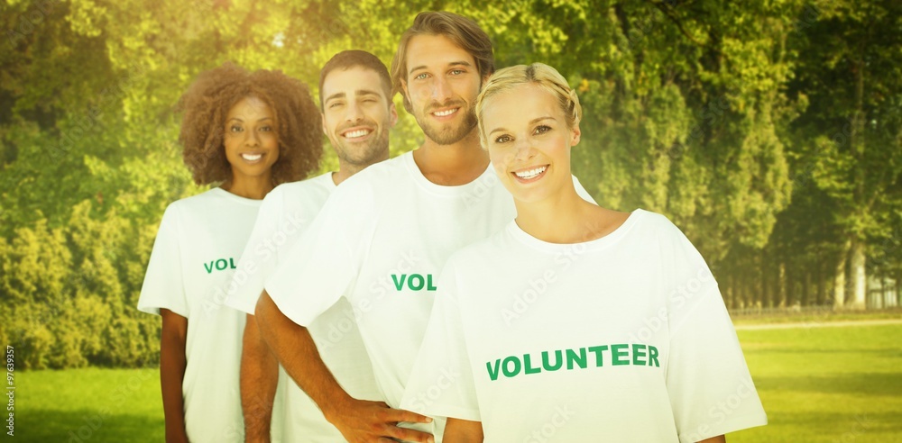 Wall mural Composite image of smiling volunteer group