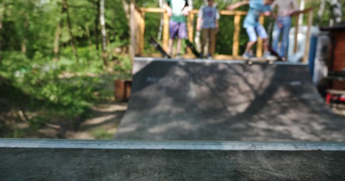 Skateboarder skating on a miniramp. Shallow depth shot in 4k.
