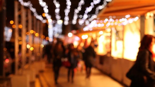 people walking in christmas market in Europe, blurred background