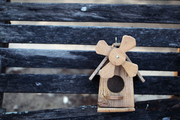 bird house on grunge wooden panel
