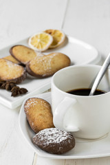 Assorted Cookies with coffee on wooden table