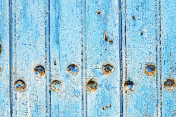 stripped paint     blue     door and rusty nail