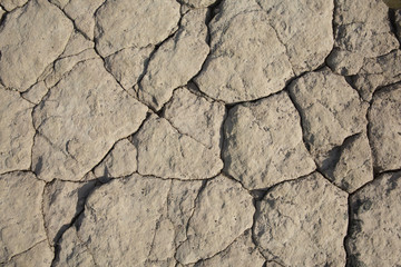 Rock surface with cracks an uneven background texture illustration