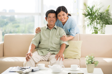 Mature man and his doctor at home