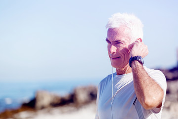 Sports and music. man getting ready for jogging