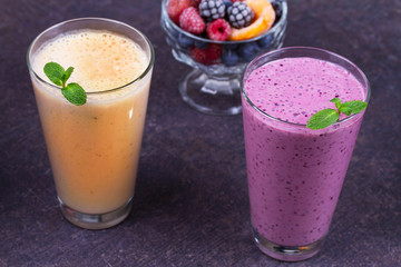 Frozen summer berries and banana milkshake garnished with mint