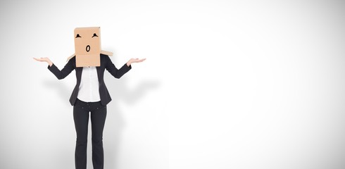 Composite image of businesswoman with box over head
