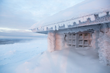 ice frozen house in Finland behind polar circle