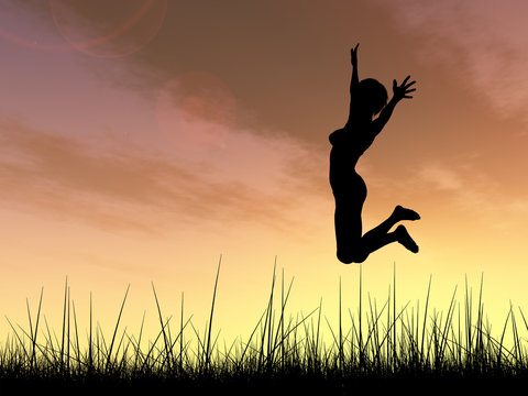 Conceptual young woman silhouette jumping happy on grass at sunset