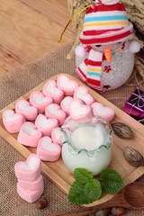 Heart pink marshmallow sweet with yogurt delicious.