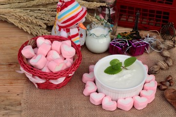 Heart pink marshmallow sweet with yogurt delicious.