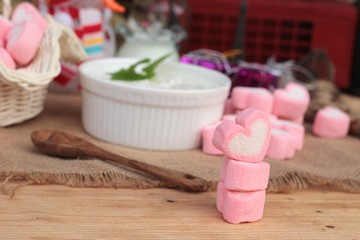Heart pink marshmallow sweet with yogurt delicious.