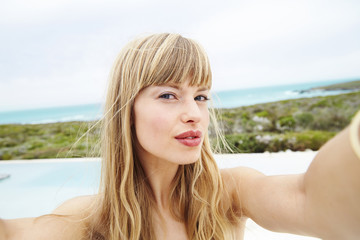 Stunning young blond woman posing for portrait