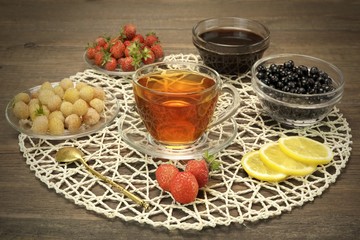 Glass Teacup, Retro Teaspoon, Bowls With Summer Berries And Hone