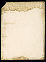 Old grunge paper sheet, isolated on black background.