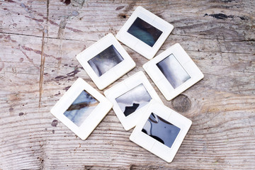 Film and slides on wooden background