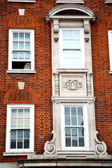 Fototapeta na wymiar in europe cold red brick c historical window