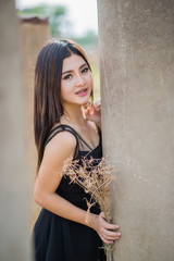 Fototapeta premium Asian girl in a meadow , light evenings