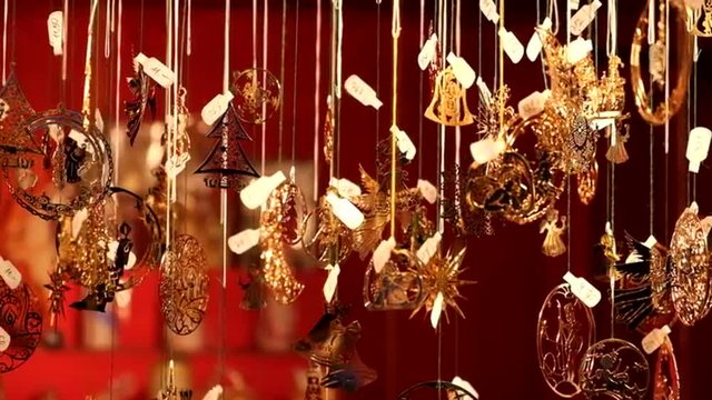 Shinning metal Christmas decorations spinning at the Christmas market in Vienna, Austria.