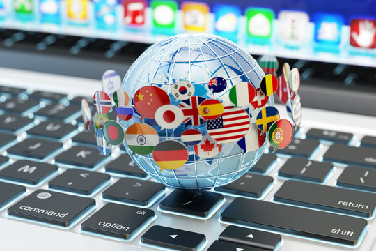 Global internet communication, online messaging and translation concept, speech bubbles with national flags of world countries around blue Earth globe on computer laptop keyboard