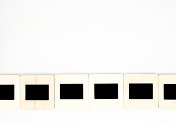 Old paper photo slides, isolated on white background.