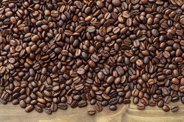 Coffee bean on wooden table background