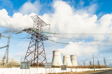 thermal power plant pipe with smoke against blue sky