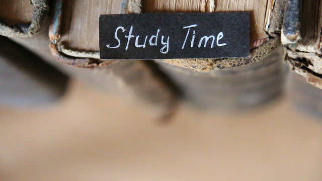 Study Time idea, inscription on the label "Study Time " and old books
