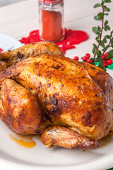 Baked chicken on white plate.