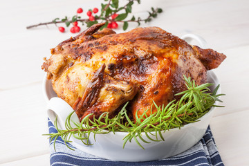 Baked chicken on white plate.