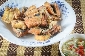 fired fish with fish sauce , thai food