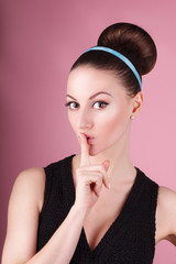 Fototapeta premium Portrait of young beautiful fresh slim girl with clean make-up and hair bun