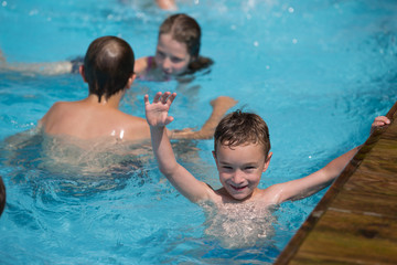Happy child in a swimming pool
