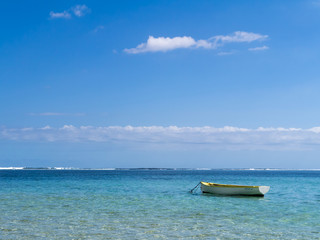Fototapeta na wymiar Boat in the ocean lagoon, Mauritius.