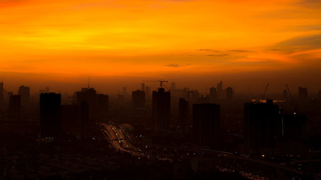 Time lapse view of Bangkok skyline at sunrise.