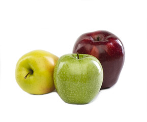 three apples of different colors on white background