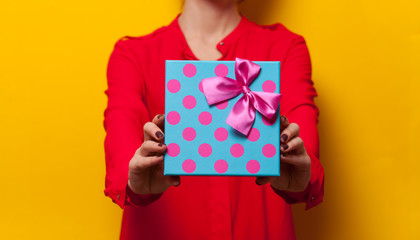 Woman holding a present box
