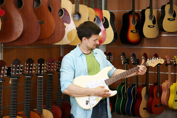 Handsome young man in music store