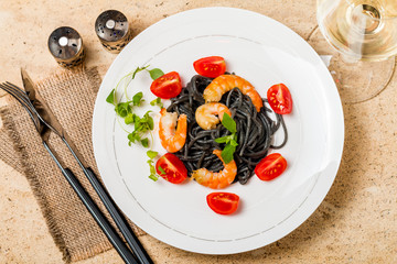Black spaghetti with prawns and cherry tomatoes