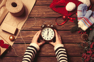 Woman holding alarm clock