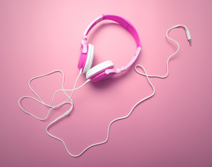 Headphones on pink background